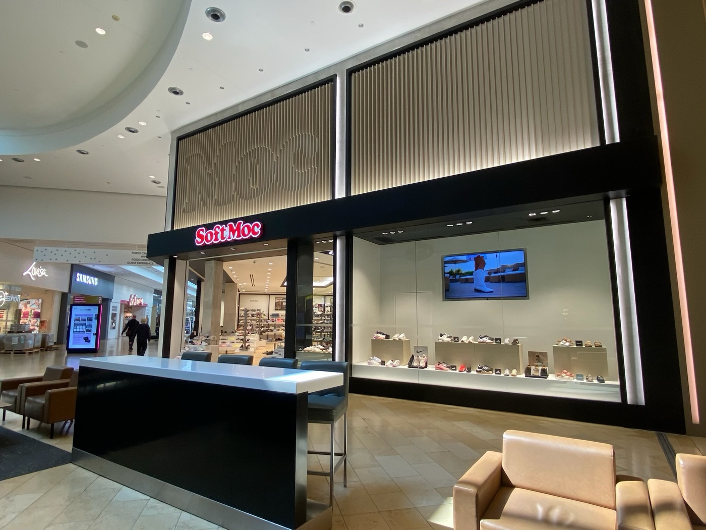 SoftMoc Square One — storefront display window with shoe pedestals