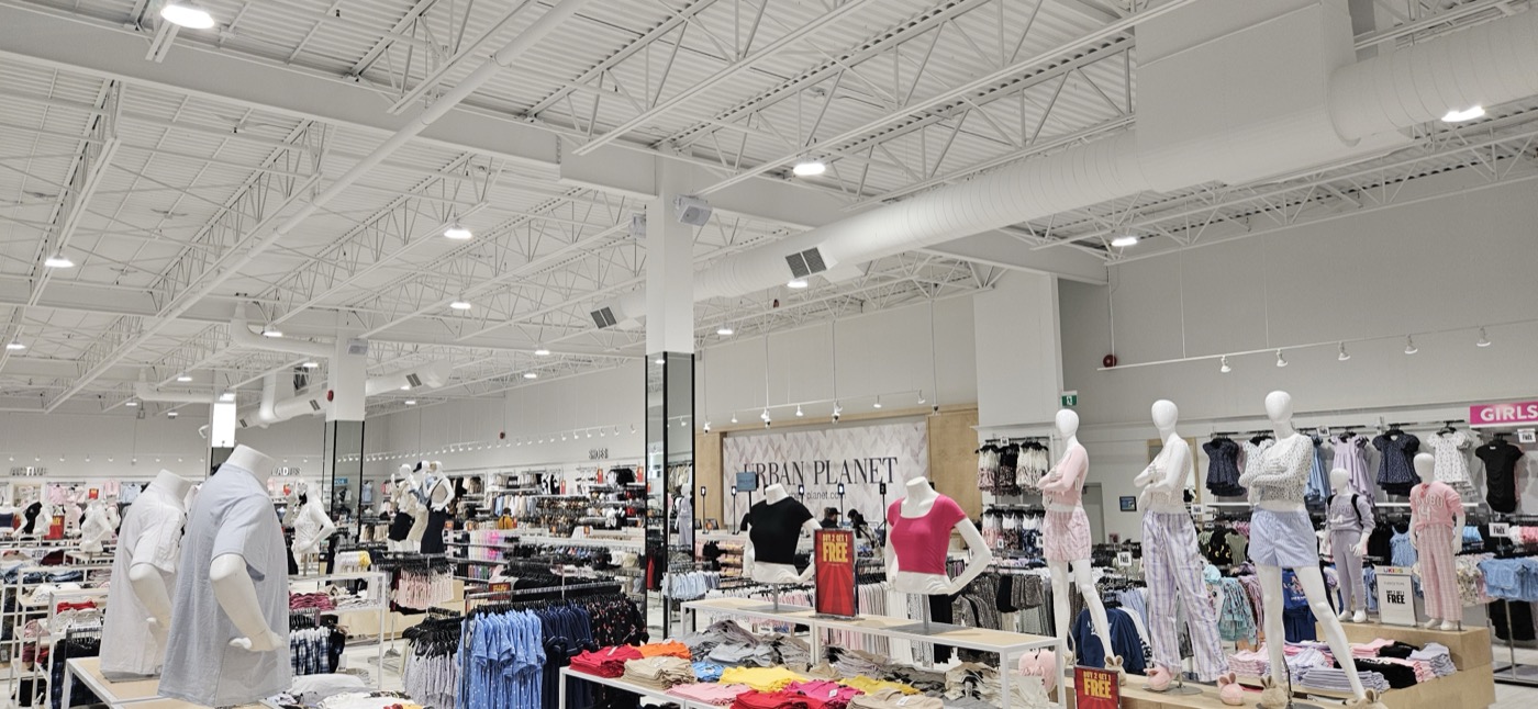 Full store interior — high ceiling and displays