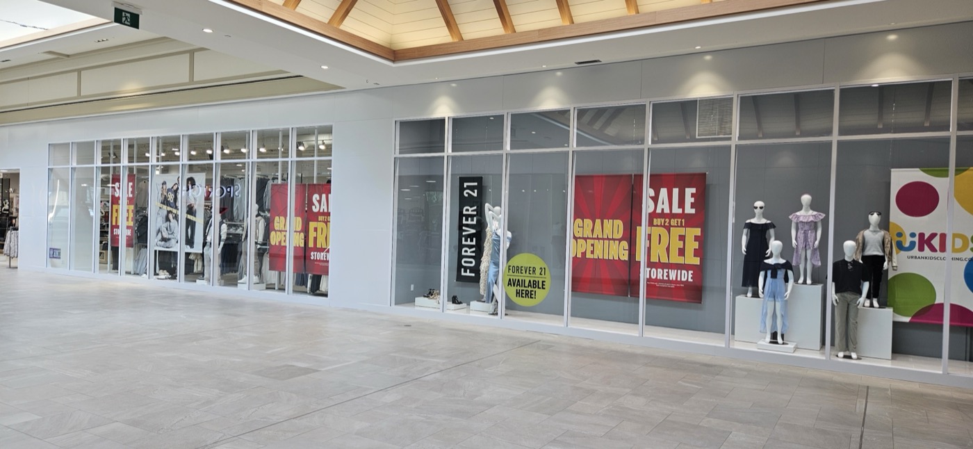 Glazed storefront façade from mall corridor